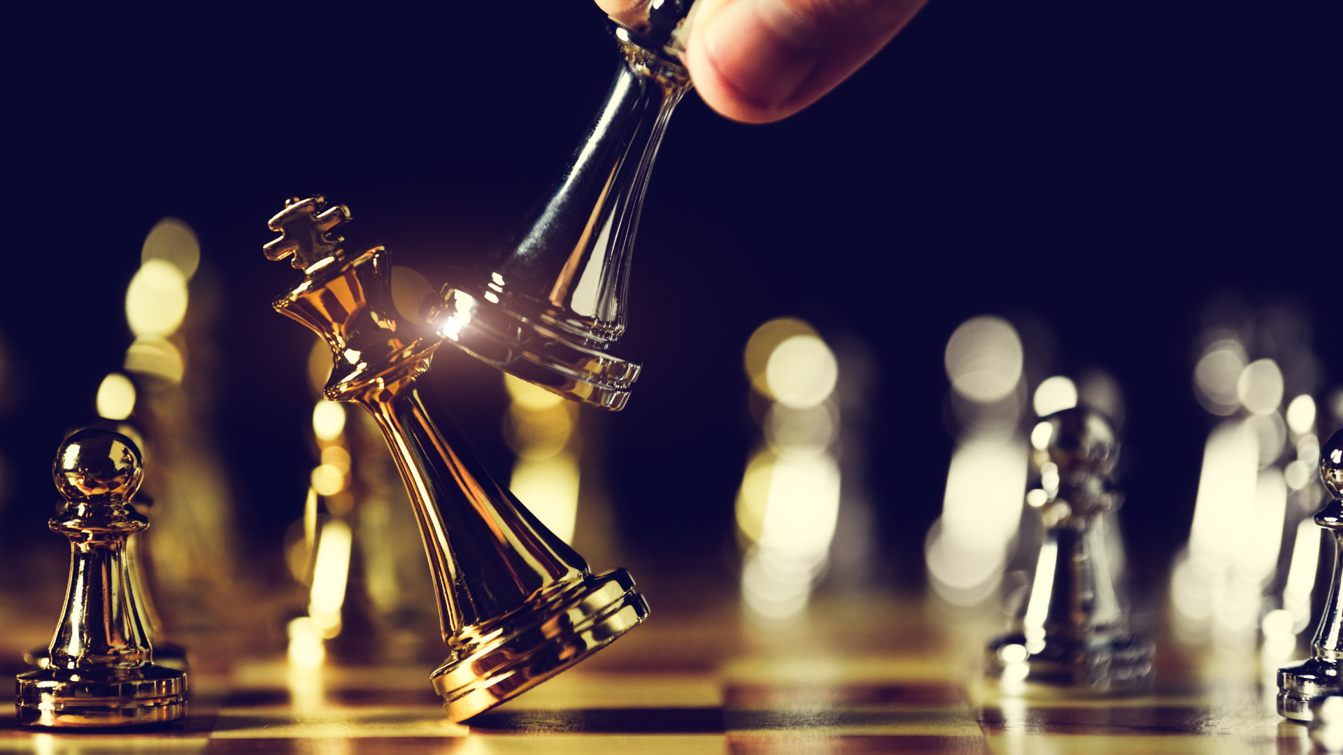 Chess pieces on a board symbolizing strategic exit planning for businesses with Meritus Group expertise