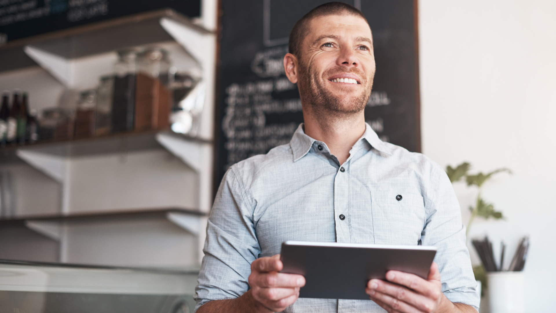 Entrepreneur analyzing business sale opportunities with Meritus Group Business Brokerage for end-of-2023 listing