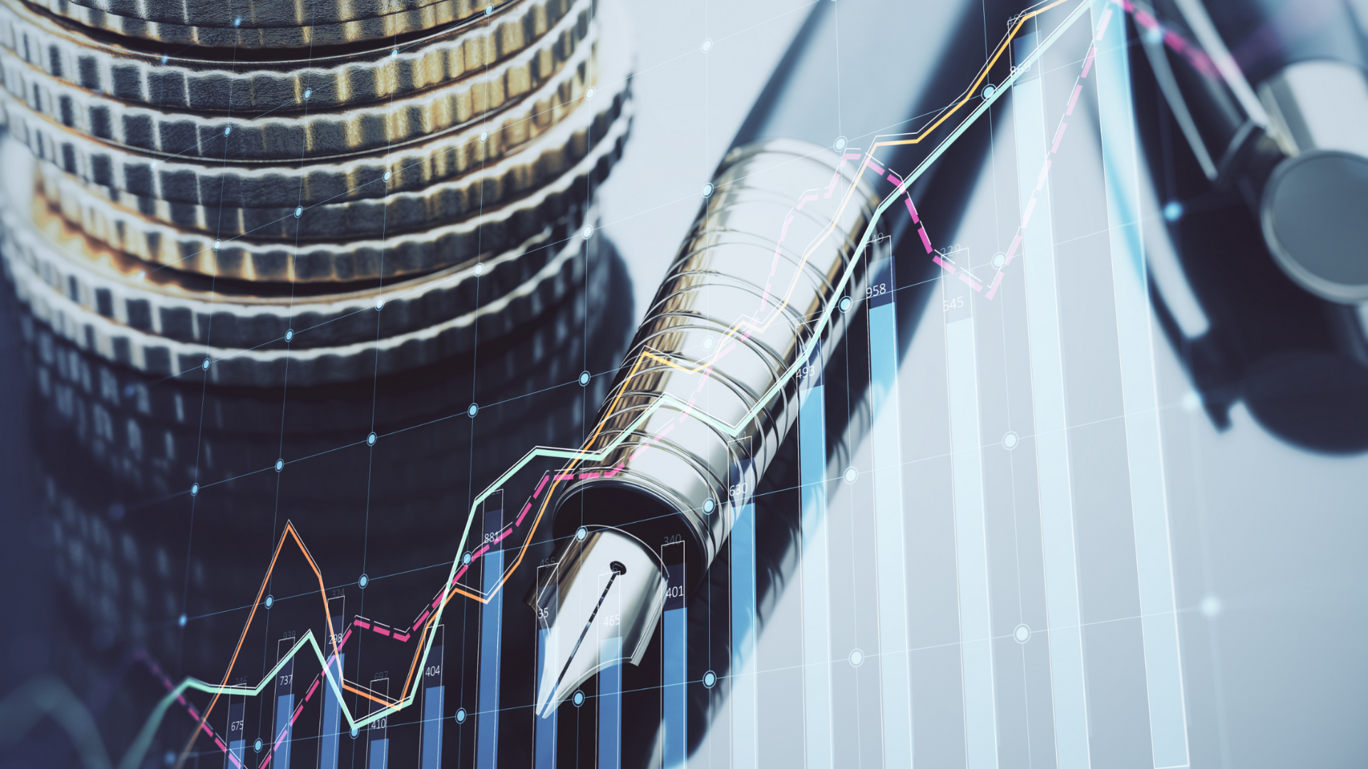 A fountain pen resting on financial charts with coin stacks, depicting precise business valuation and growth.