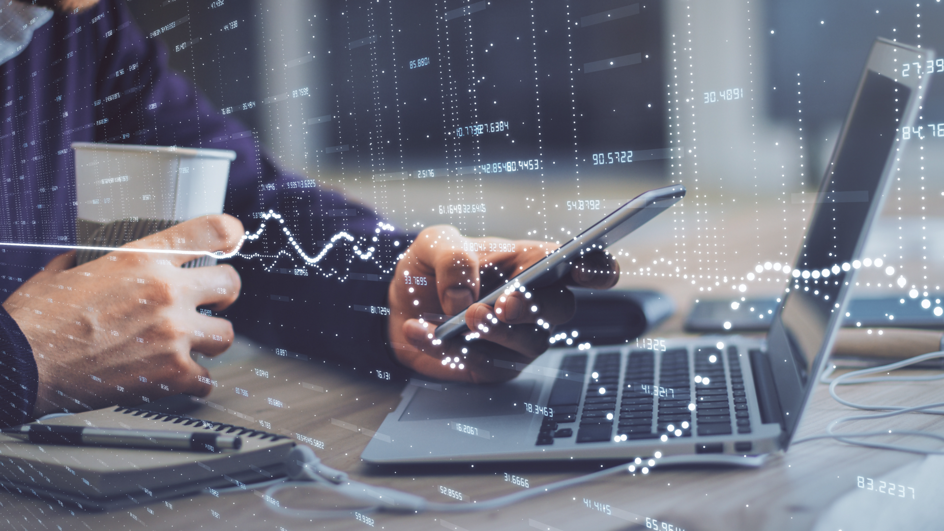 Broker analyzing latest business brokerage trends on a computer