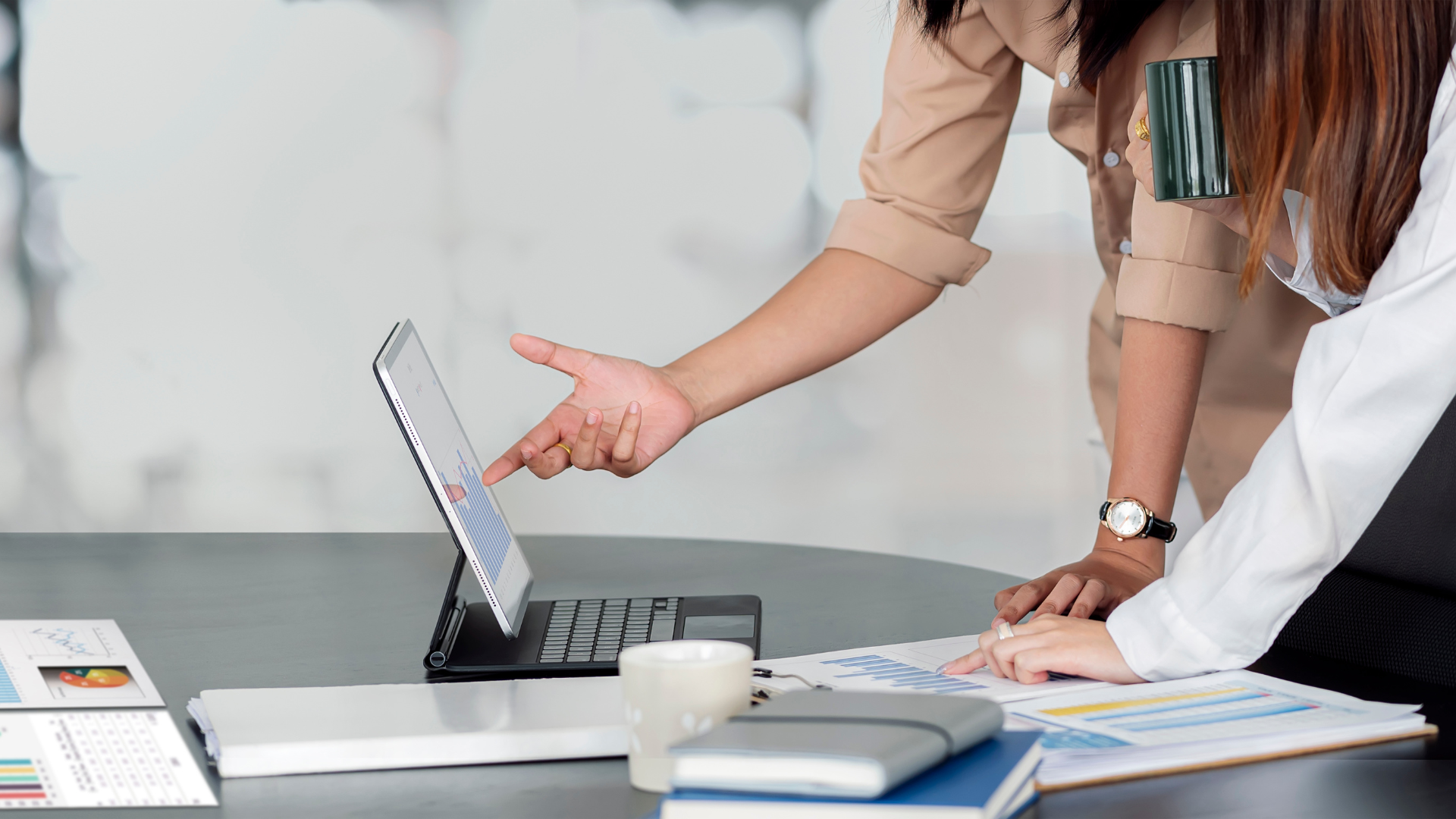 Business owner reviewing financial documents with a valuation expert