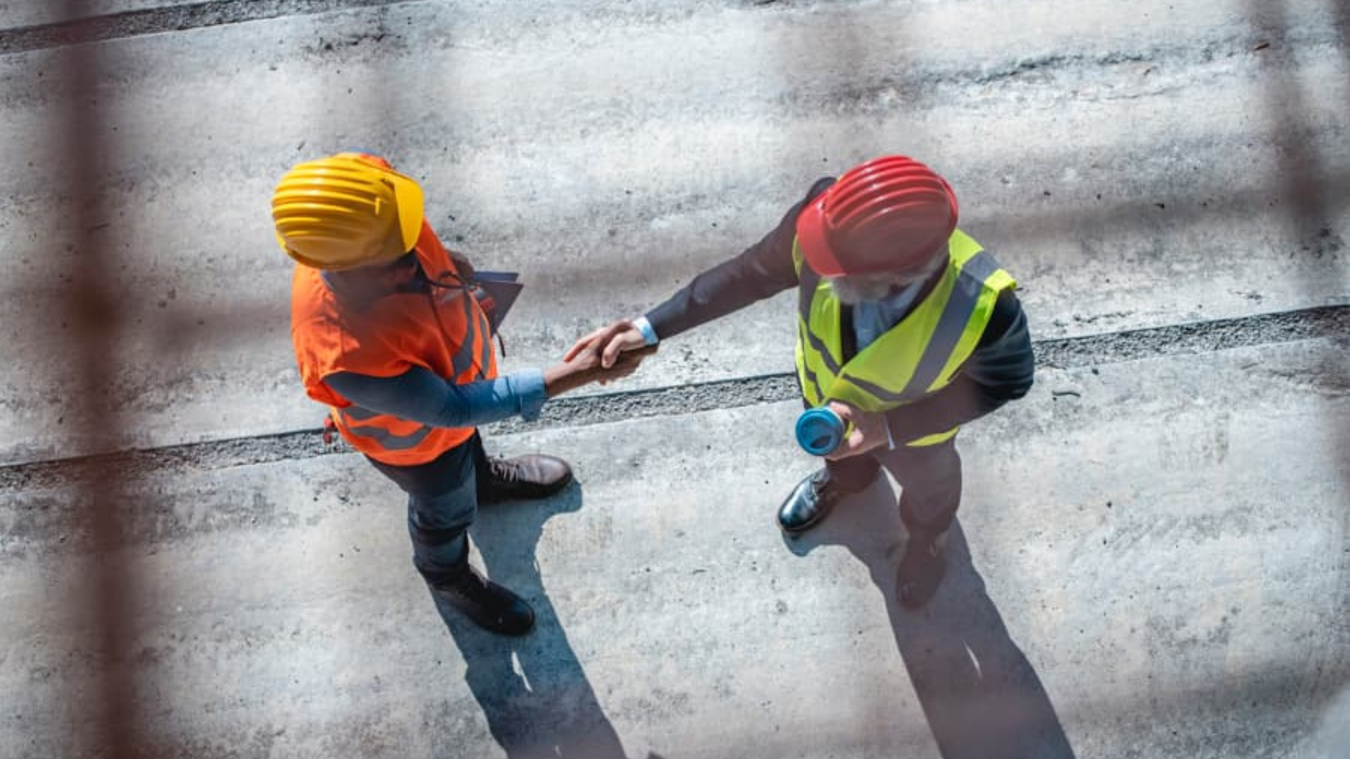 Business owner and Meritus Group broker shaking hands, symbolizing a successful partnership in selling a business