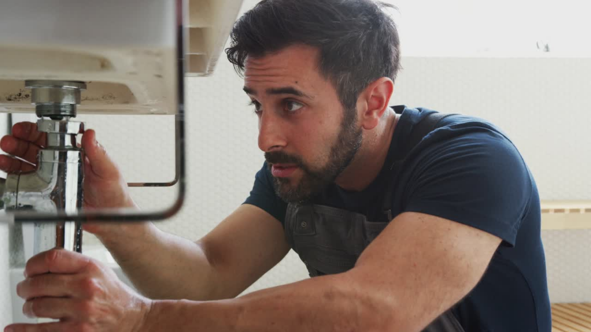 Plumbing business owner discussing sale strategies with business broker