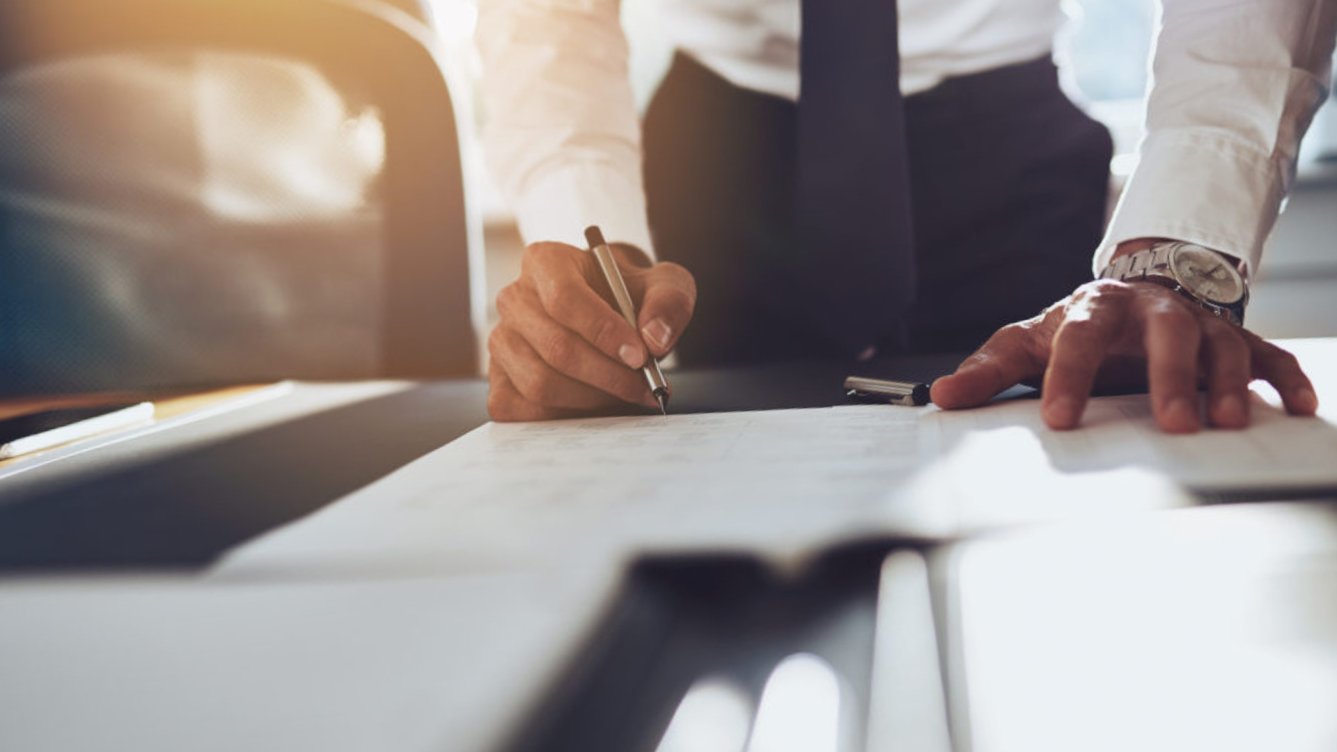 Business owner reviewing internal systems and team performance to improve business value
