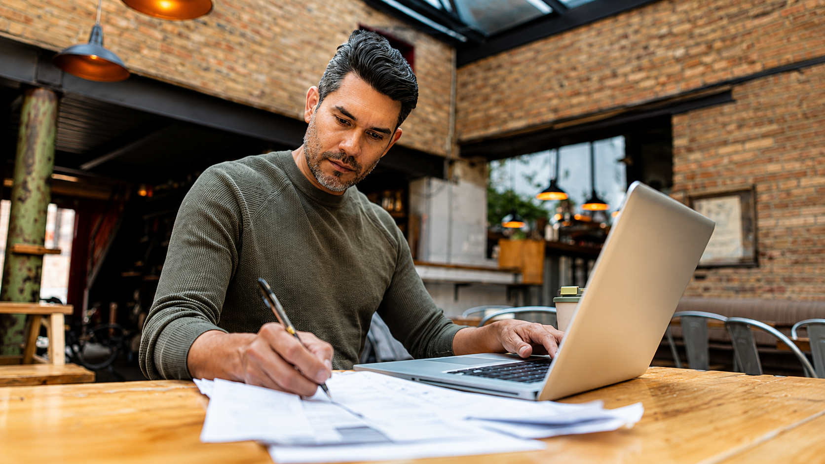 Prospective buyer reviewing financials before acquiring an established business